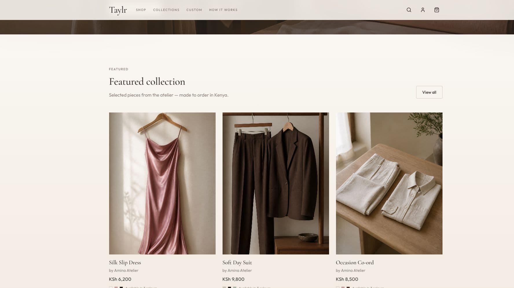 Taylr homepage featured collection grid of three Amina Atelier pieces — Silk Slip Dress, Soft Day Suit, and Occasion Co-ord — with Kenyan shilling prices and colour swatches.